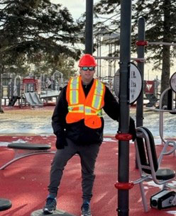 Cory Auger standing in a playground