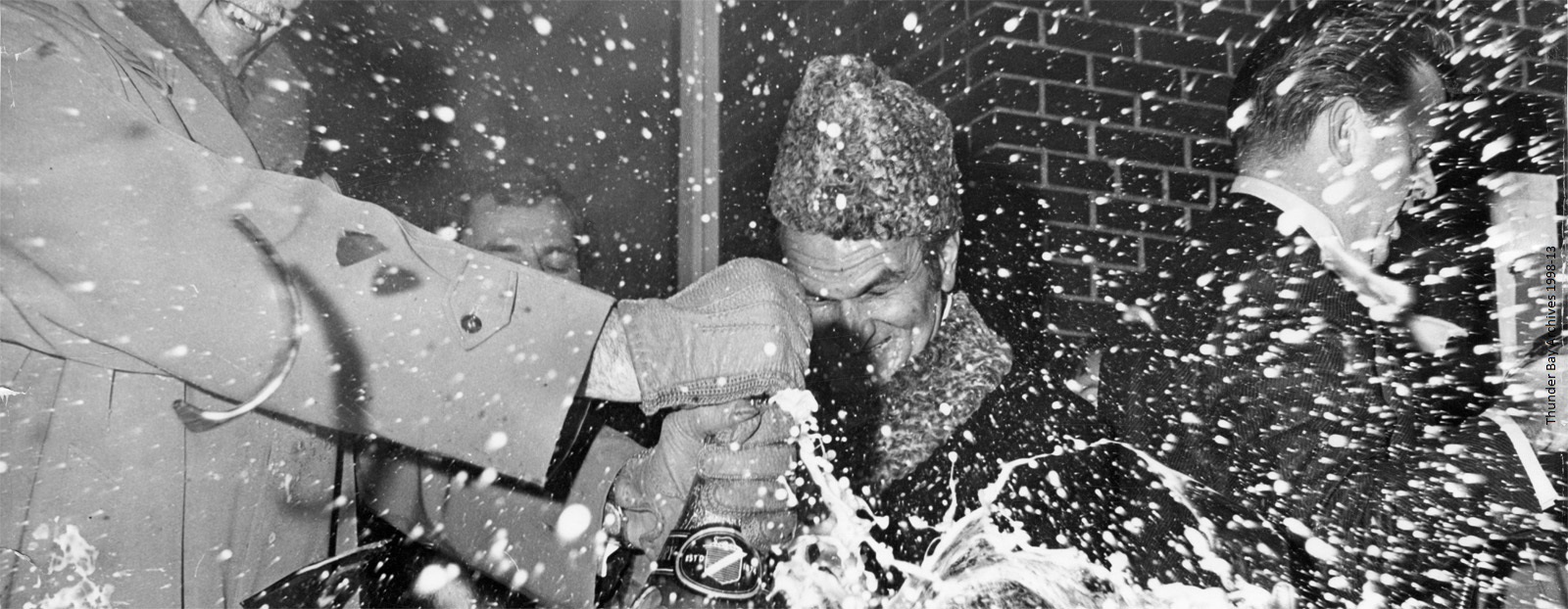 Champagne Celebration of Amalgamation, 1 January 1970 Four men are shown smashing a bottle of champagne as it sprays