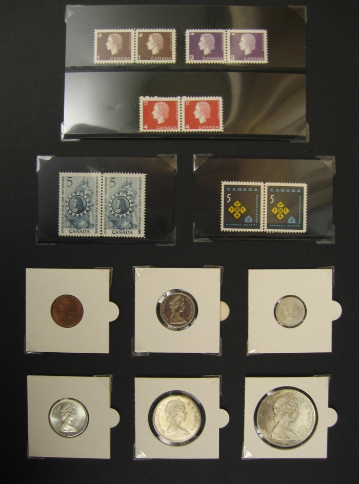 Stamps and Coins, 1966 Various small coins and stamps are taped to a black sheet