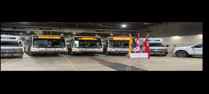 Buses at the transit funding announcement