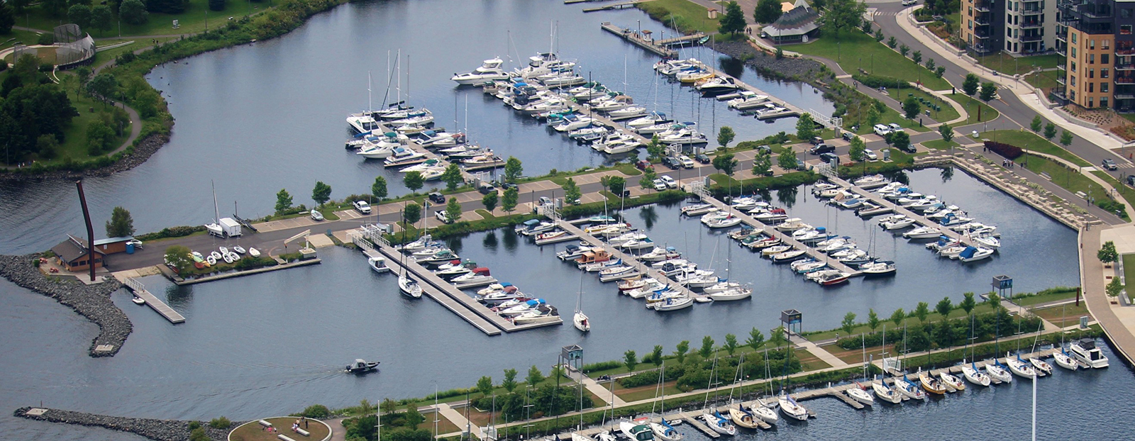 Aerial photograph of Thunder Bay's Marina, showing boat slips and surrounding parkland at Prince Arthur's Landing.